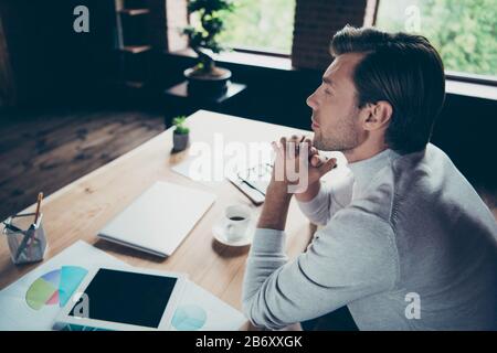 Profile side view portrait of his he nice attractive candid calm executive top partner company founder director money budget salary growth planning at Stock Photo