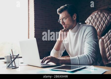 Profile side view portrait of nice attractive content remote assistant partner consultant self-employed freelance preparing presentation at industrial Stock Photo