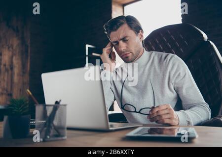 Portrait of his he attractive intellectual shark financier economist analyst marketer company founder having negative feeling bad at industrial loft Stock Photo