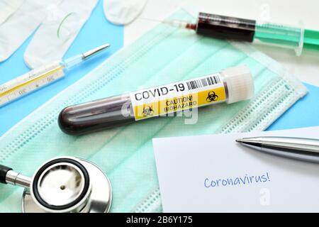 Blutentnahmeroehrchen mit Aufschrift Covid-19, Symbolfoto Coronavirus Stock Photo