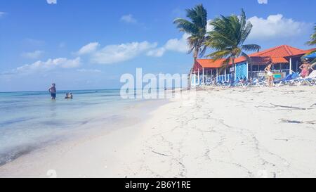 A beautiful sandy beach in paradise caribbean in front of Cuba. Amazing island with palms and blue sea. High quality photo Stock Photo