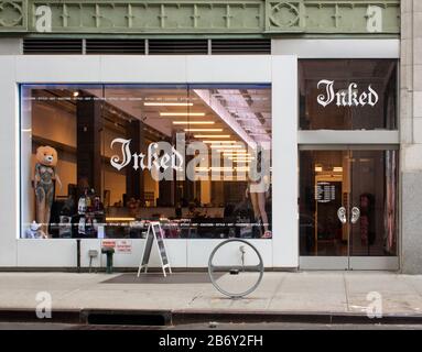 facade of a tattoo parlor in the chelsea neighborhood of manhattan, new york called Inked. Stock Photo