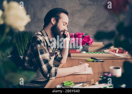 Profile side view photo concentrated self-employed person small business representative hold hand apps modern technology conversation dialogue Stock Photo