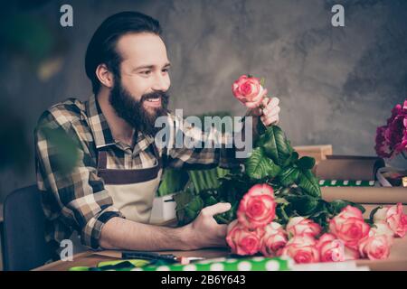 Profile side view photo cute charming sweet lovely millennial hold hand rosebud environment self-employed small business representative hobby gift Stock Photo