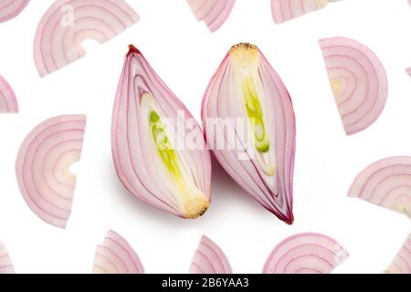 Halved shallot and red onion half moon slices on white Stock Photo