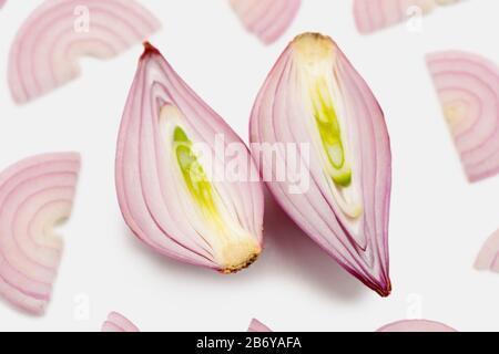 Halved shallot onion and half moon slices Stock Photo