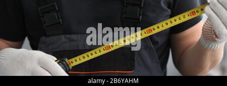 Man holding measuring device Stock Photo