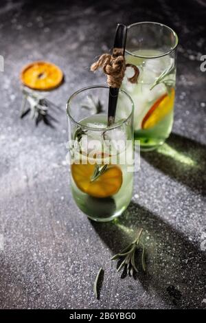 Orange mint drink in a glass.Water in a glass.Spring time.Delicious food and dessert Stock Photo