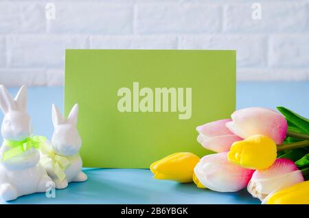 Happy Easter. Empty copyspace easter card. Easter background with decorative white rabbits. Stock Photo