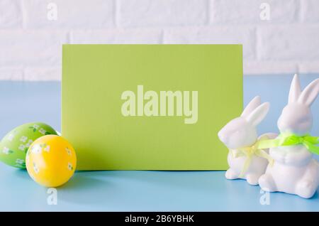 Happy Easter. Empty copyspace easter card. Easter background with decorative white rabbits. Stock Photo