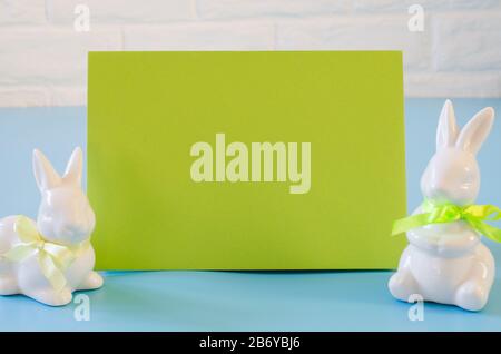 Happy Easter. Empty copyspace easter card. Easter background with decorative white rabbits. Stock Photo