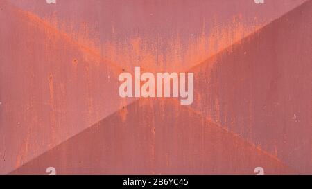An old, rusty, colored plate with traces of background painting Stock Photo