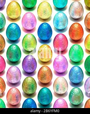 Easter eggs, chocolate, foil wrapped, multiple geometric array against a white background Stock Photo