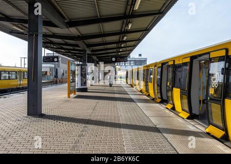 Hönow U-Bahn railway station, Eastern terminus of the U5 rail line in Berlin-Hellersdorf, Germany. Platform and yellow train carriage Stock Photo