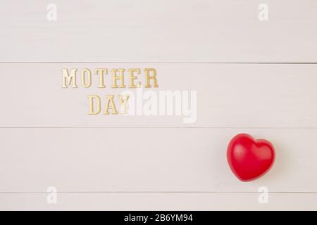 Happy mother day with symbol heart shape and text on wooden table, feeling romantic and care with decoration, word and massage present in festive with Stock Photo