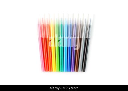 Multi-colored felt-tip pens, markers on a white isolated background. Rainbow colors overall plan, top view. Stock Photo