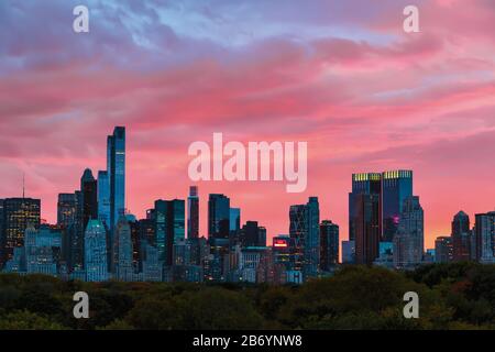 Skyline seen over Central Park at dusk, New York City, New York State, United States of America. Stock Photo