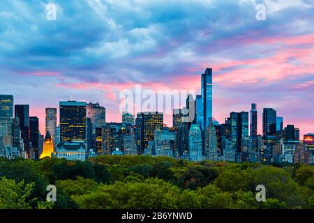 Skyline seen over Central Park at dusk, New York City, New York State, United States of America. Stock Photo