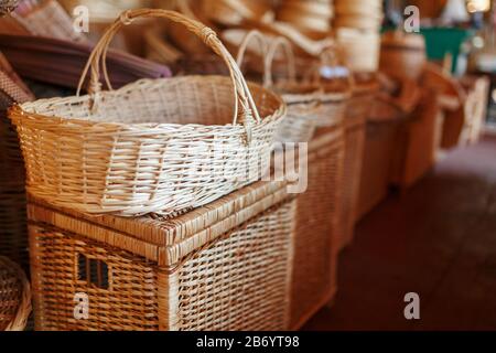 Handmade wicker furniture, products and souvenirs at the street craft market. Wicker baskets in a street market Stock Photo