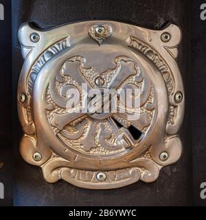 Detail of a flue damper on an old fashioned wood burning kitchen stove Stock Photo