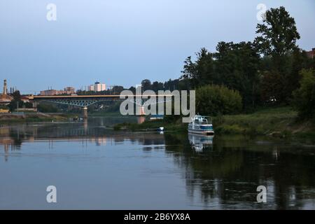 View of the wide Neman river over the bridge in the evening Stock Photo