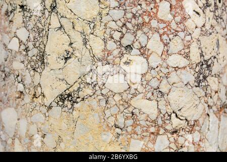 Antique pink marble with cracks, stone texture background, Full screen. The ruins of ancient antiquity Stock Photo