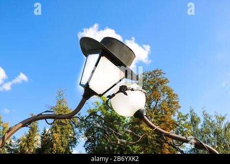 Beautiful street lighting against a blue sky. Love concept Stock Photo