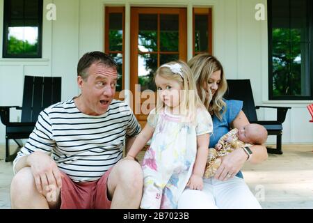 Cropped portrait of a toddler girl making a funny face at the camera Stock Photo