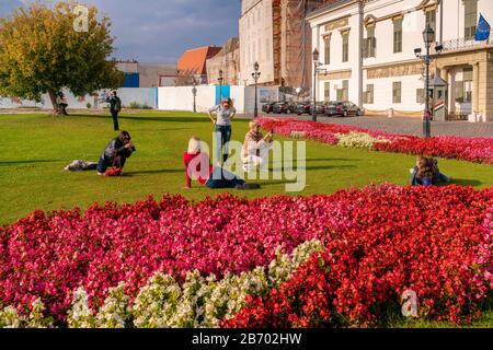 Tourists taking selfies in front of the SÃ¡ndor Palace Stock Photo