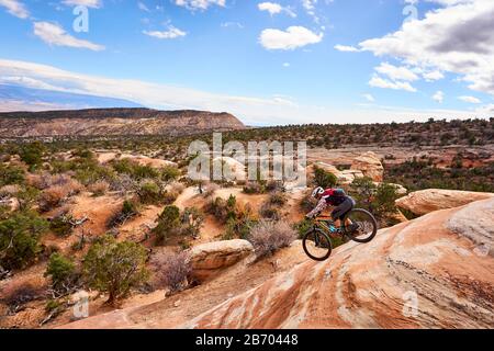 A man riding his mountain bike in the Colorado desert. Stock Photo