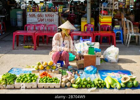 Vietnamese woman selling vegetables at An Binh market, Can Tho, Mekong Delta, Vietnam Stock Photo