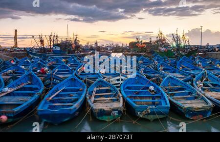 Morocco, Marrakesh-Safi (Marrakesh-Tensift-El Haouz) region, Essaouira. Boats in the old fishing port at sunset. Stock Photo