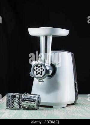 https://l450v.alamy.com/450v/2b70acj/meat-grinder-on-a-black-background-countertop-in-the-kitchen-2b70acj.jpg
