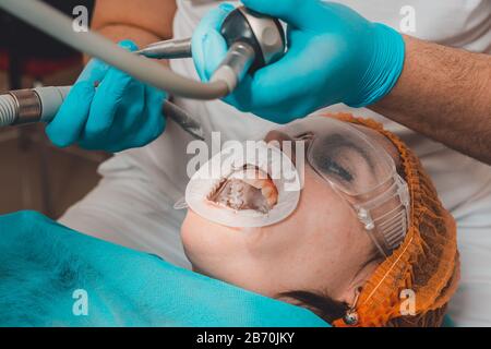 The patient visits the dentist for a dental ultrasound procedure at a dental clinic.2020 Stock Photo