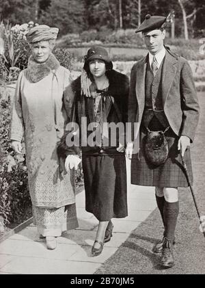 Mary of Teck with the Duke and Duchess of York, seen here at Balmoral in 1924.  Mary of Teck, 1867 -1953. Queen of the United Kingdom and Empress of India as the wife of King-Emperor George V.  Duchess of  York, future Queen Elizabeth, The Queen Mother.  Elizabeth Angela Marguerite Bowes-Lyon, 1900 – 2002.  Wife of King George VI and mother of Queen Elizabeth II.  Prince Albert Frederick Arthur George, Duke of York, future George VI, 1895 – 1952.  King of the United Kingdom and the Dominions of the British Commonwealth. From King George the Sixth, published 1937. Stock Photo