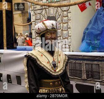 Rijeka, Croatia, February 23rd, 2020. Little black boy Morcic with white turban on head, traditional historical costume on the carnival parade in the Stock Photo