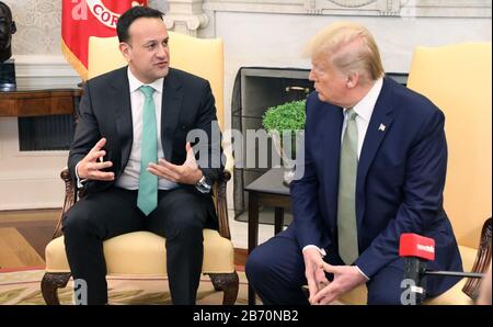 Washington, United States Of America. 12th Mar, 2020. United States President Donald J. Trump points to a member of the media during a meeting with Taoiseach (Prime Minister) Leo Varadkar of Ireland, in the Oval Office of the White House in Washington, DC, U.S., on Thursday, March 12, 2020. Credit: Irish Eye/Alamy Live News Stock Photo