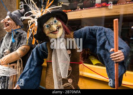 Streetscene in the old town area of Baiona, with witch dolls for sale.  Spain Stock Photo