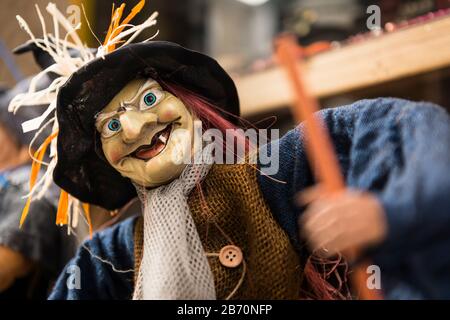Street scene in the old town area of Baiona, with witch doll for sale.  Spain Stock Photo