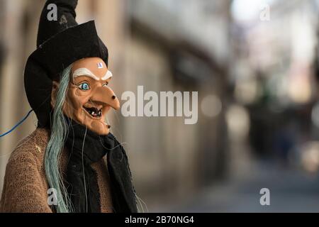 Street scene in the old town area of Baiona, with close up of a witch doll for sale.  (price on forehead) Spain Stock Photo