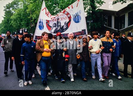 On 11 May 1985, over 2000 people participated in a militant but peaceful demonstration that was allowed to complete its route to Plashet Park. However, in a tense atmosphere, the manhandling by police of one black youth led to confrontation, the emergence of officers on horseback and riot officers who charged into the park. It appeared that this had been deliberately engineered: three to four white men in ordinary clothes were seen throwing sticks at the police; but were later seen behind police lines with police radios. Later, riot officers paraded along Green Street and East ham High Street Stock Photo