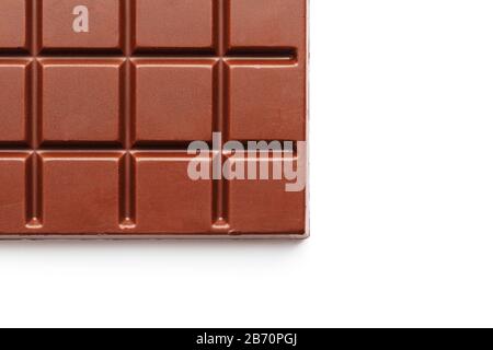 Square-shaped milk chocolate on a white background from above. Isolated A whole plate of dark chocolate isolated on white from above Stock Photo