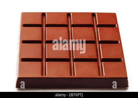 Square-shaped milk chocolate on a white background from above. Isolated A whole plate of dark chocolate isolated on white from above Stock Photo