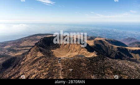 Aerial View of Hallasan Mountain on Jeju Island, South Korea. Lake, Crater Valley and Slope of Volcano. Stock Photo