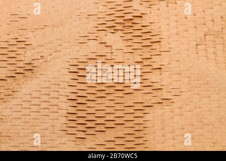A perforated paper texture in a close up view Stock Photo