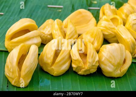 Jackfruit (Artocarpus heterophyllus) flesh on a banana leaf Stock Photo