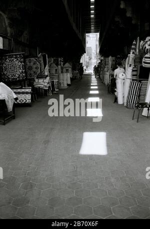 Street of the tentmakers Al Khayamiya in the historic Qasaba of Radwan Bey a market souk bazaar in Islamic Cairo in Egypt in North Africa Middle East Stock Photo