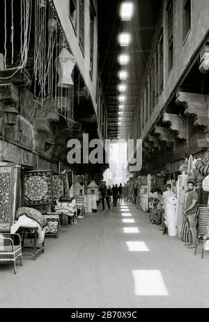 Street of the tentmakers Al Khayamiya in the historic Qasaba of Radwan Bey a market souk bazaar in Islamic Cairo in Egypt in North Africa Middle East Stock Photo
