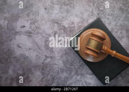 top view of wooden table and book on black background  Stock Photo