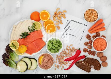 Low glycemic health food for a diabetic diet with value list & corresponding foods high in vitamins, minerals, antioxidants, protein & omega 3. Stock Photo